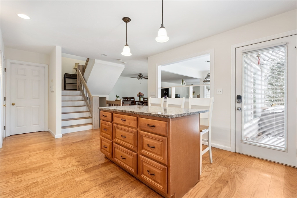 2 Arrowhead Circle, Unit 2 Ashland, MA 01721 - Photo 5 of 22 a view of kitchen with cabinets and wooden floor