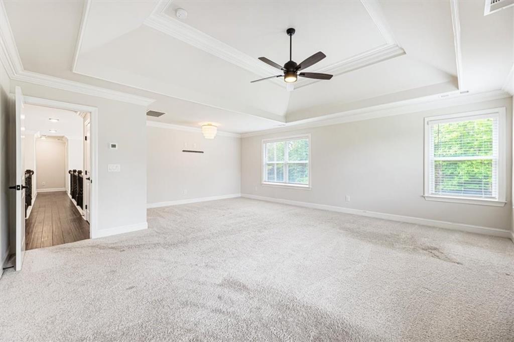947 Hunter Way Milton, GA 30004 - Photo 45 of 78 a view of a livingroom with a ceiling fan and window