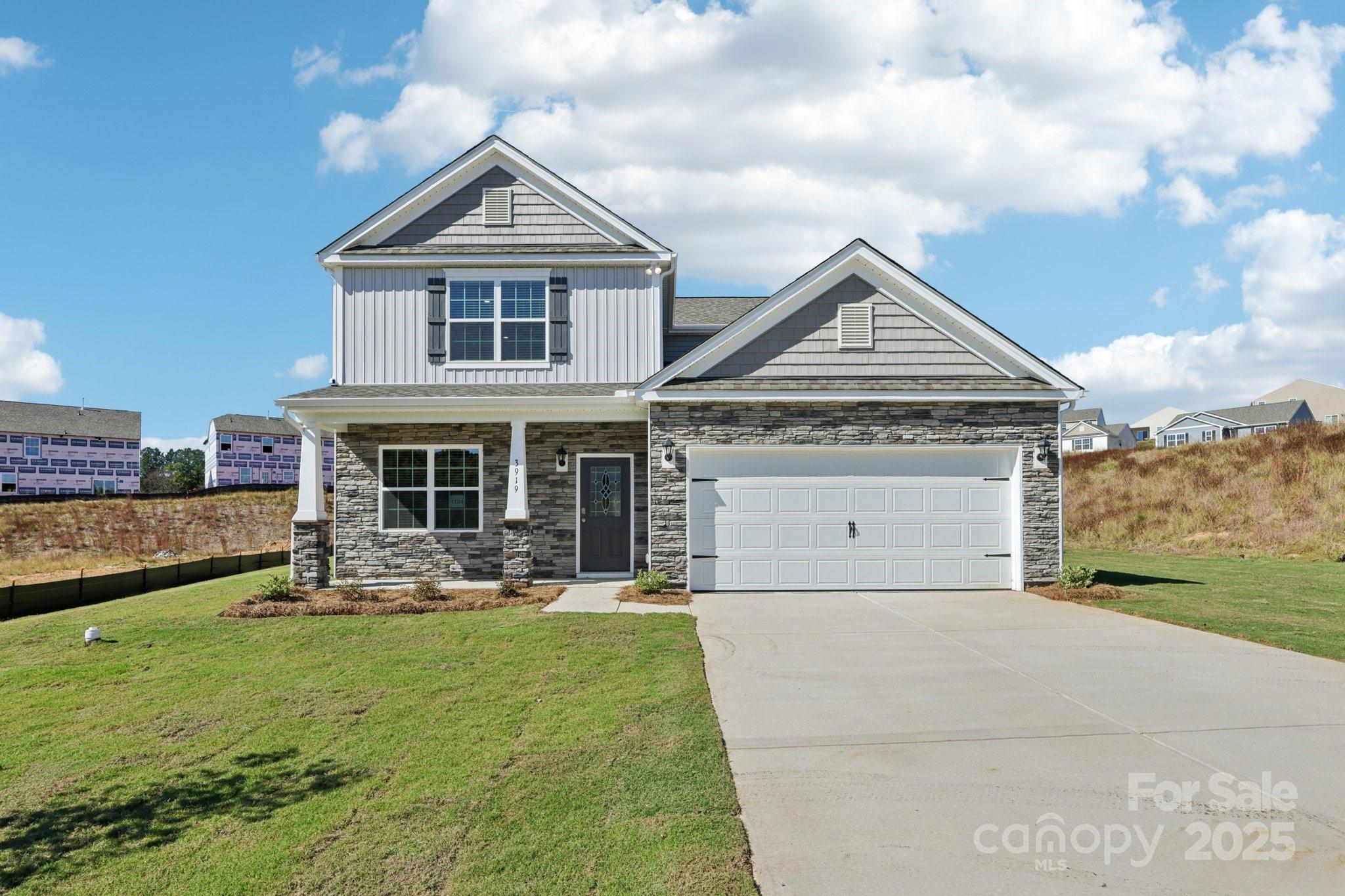 a front view of a house with a yard table and chairs