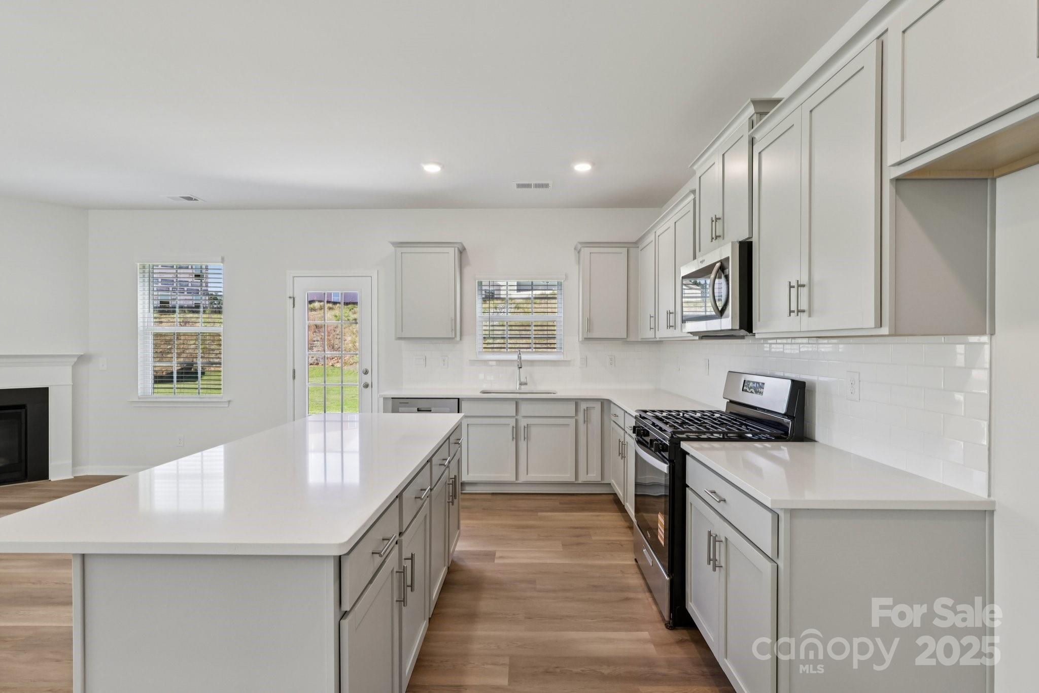 3919 Caroline Court Northwest Conover, NC 28613 - Photo 11 of 35 a kitchen with a sink stove and cabinets