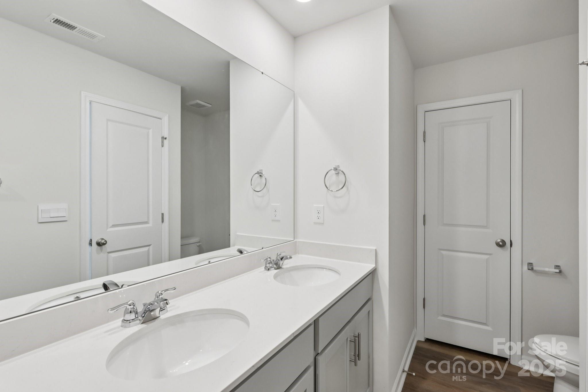 3919 Caroline Court Northwest Conover, NC 28613 - Photo 26 of 35 a bathroom with a sink and a mirror