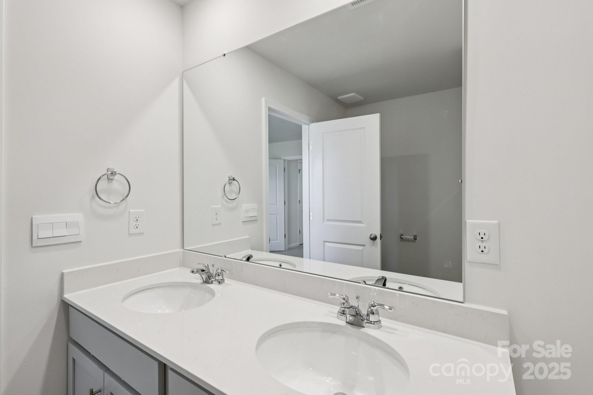 3919 Caroline Court Northwest Conover, NC 28613 - Photo 30 of 35 a bathroom with a sink and a mirror