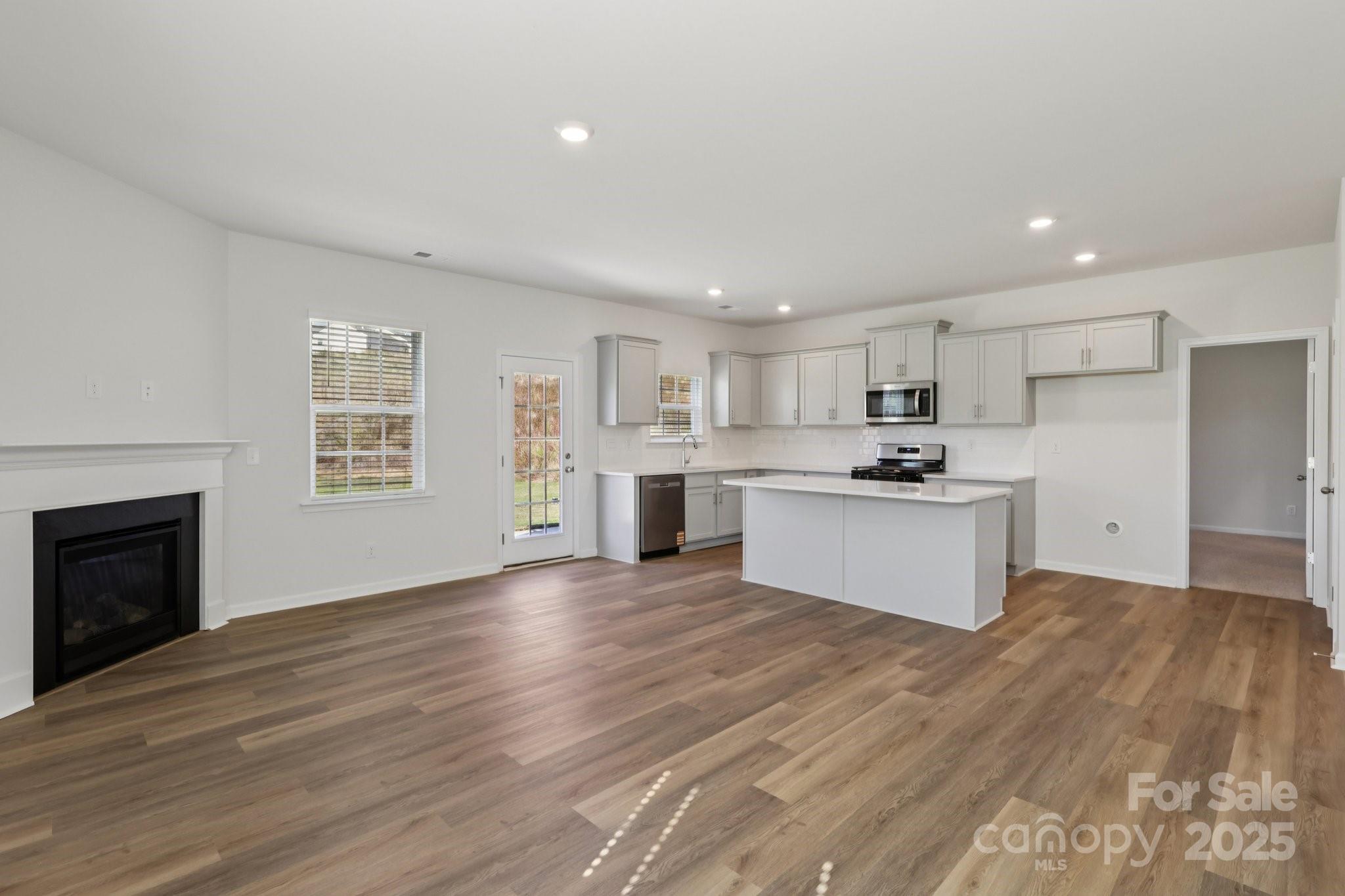 3919 Caroline Court Northwest Conover, NC 28613 - Photo 7 of 35 a view of kitchen with granite countertop cabinets and stainless steel appliances