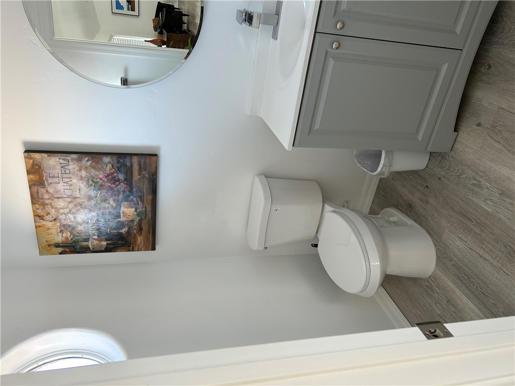 2191 Seneca Street Kingman, AZ 86401 - Photo 10 of 26 a bathroom with a toilet sink and mirror