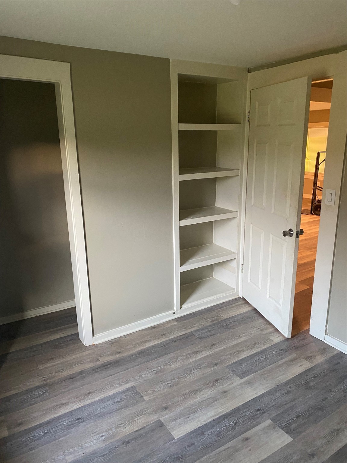 983 County Road, Unit 4350 Woodville, TX 75979 - Photo 15 of 18 a view of a room with wooden floor