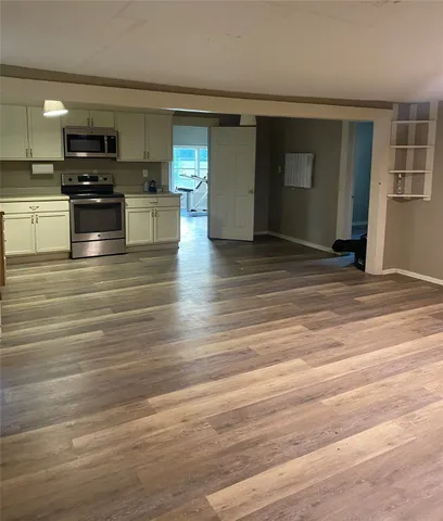 a view of kitchen and microwave