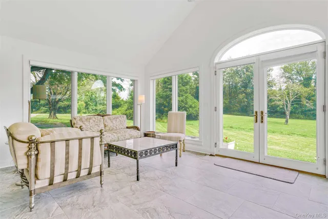 a room with furniture and a large window