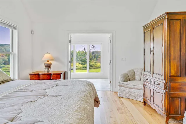 a bedroom with furniture and a window