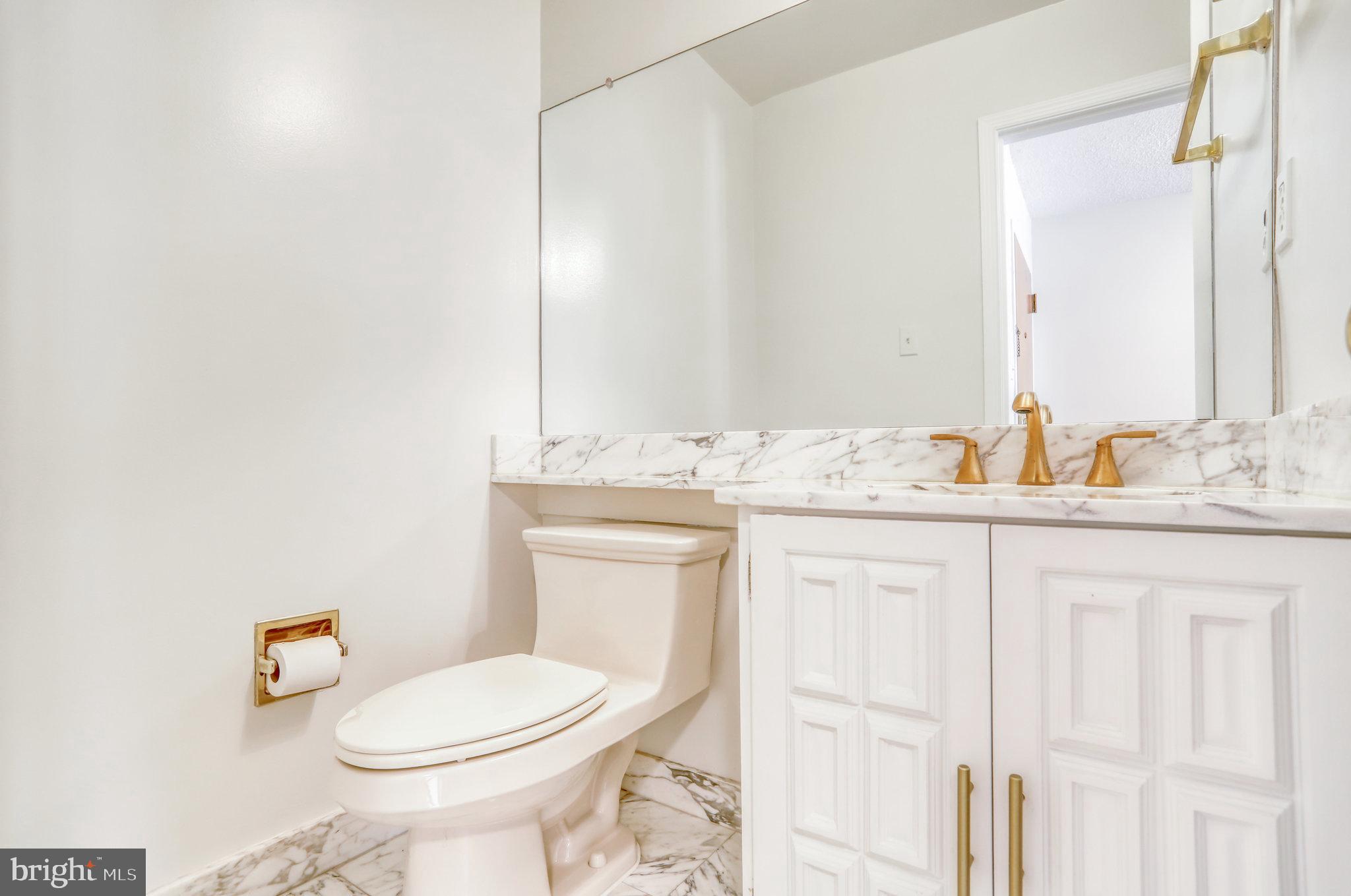 1101 South Arlington Ridge Road, Unit 114 Arlington, VA 22202 - Photo 11 of 44 Half bath next to entrance