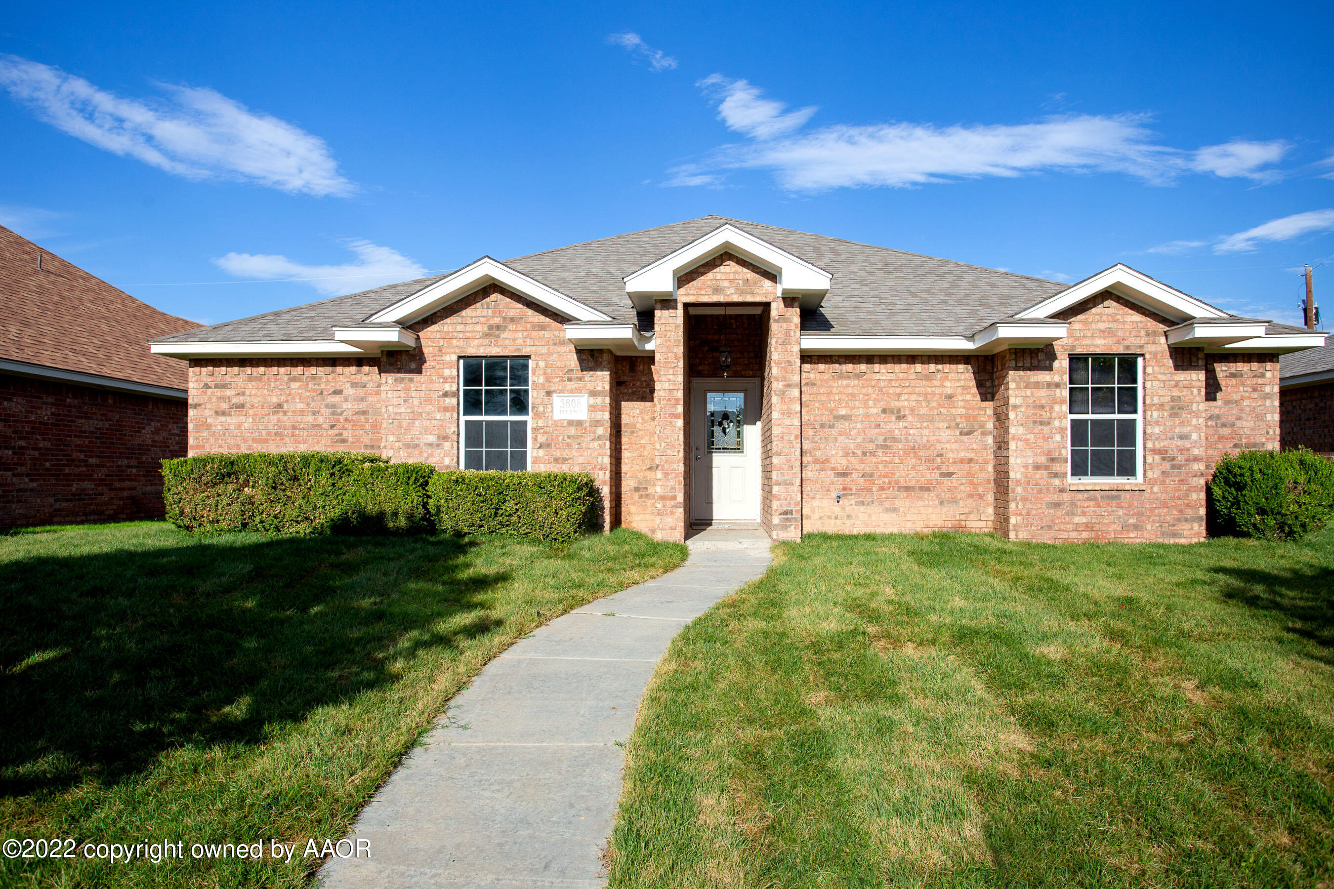 3808 Ross Street Amarillo, TX 79118 - Photo 1 of 22 a front view of a house with a yard