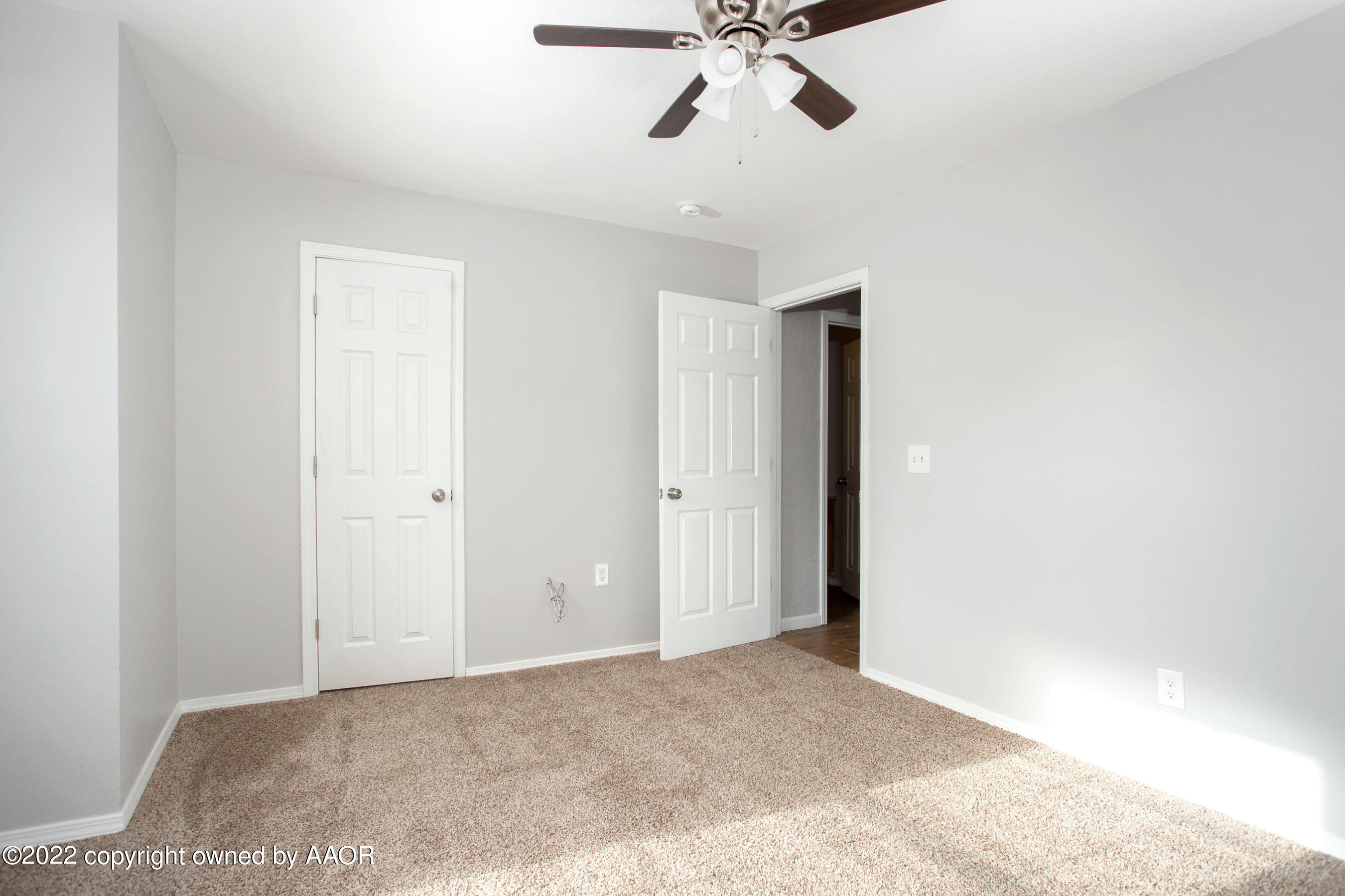 3808 Ross Street Amarillo, TX 79118 - Photo 18 of 22 a view of an empty room and chandelier fan