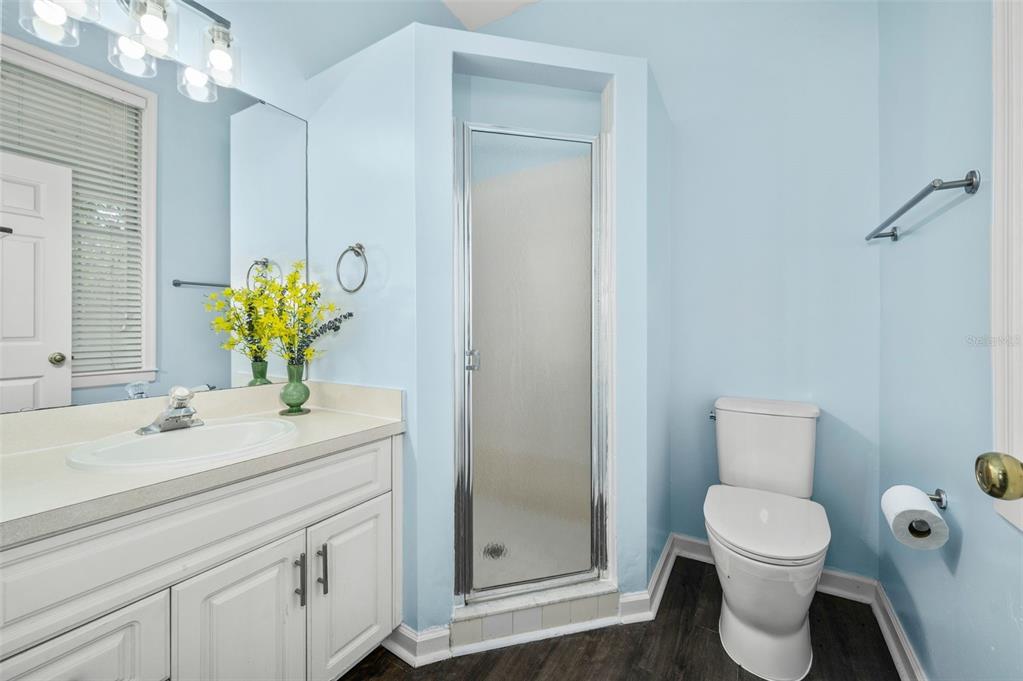 5213 Southwest 91 Terrace, Unit B Gainesville, FL 32608 - Photo 15 of 38 a bathroom with a toilet sink and mirror