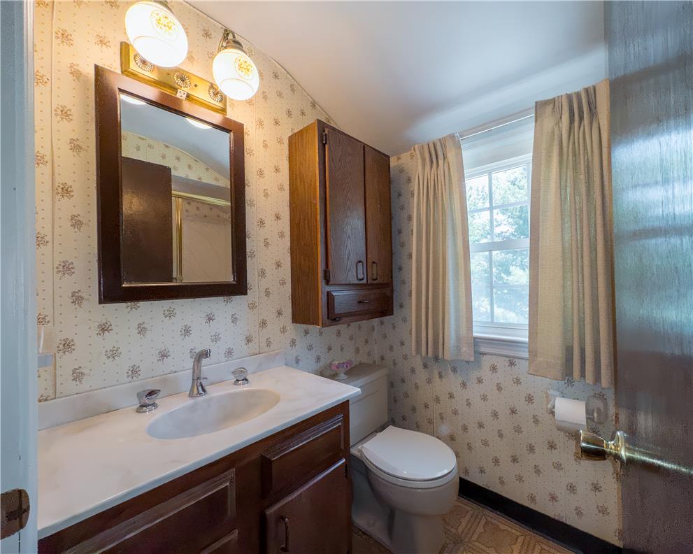 2270 Rodgers Street Bethlehem, PA 18017 - Photo 14 of 24 This functional bathroom features a single vanity, a toilet, and a window for natural light.