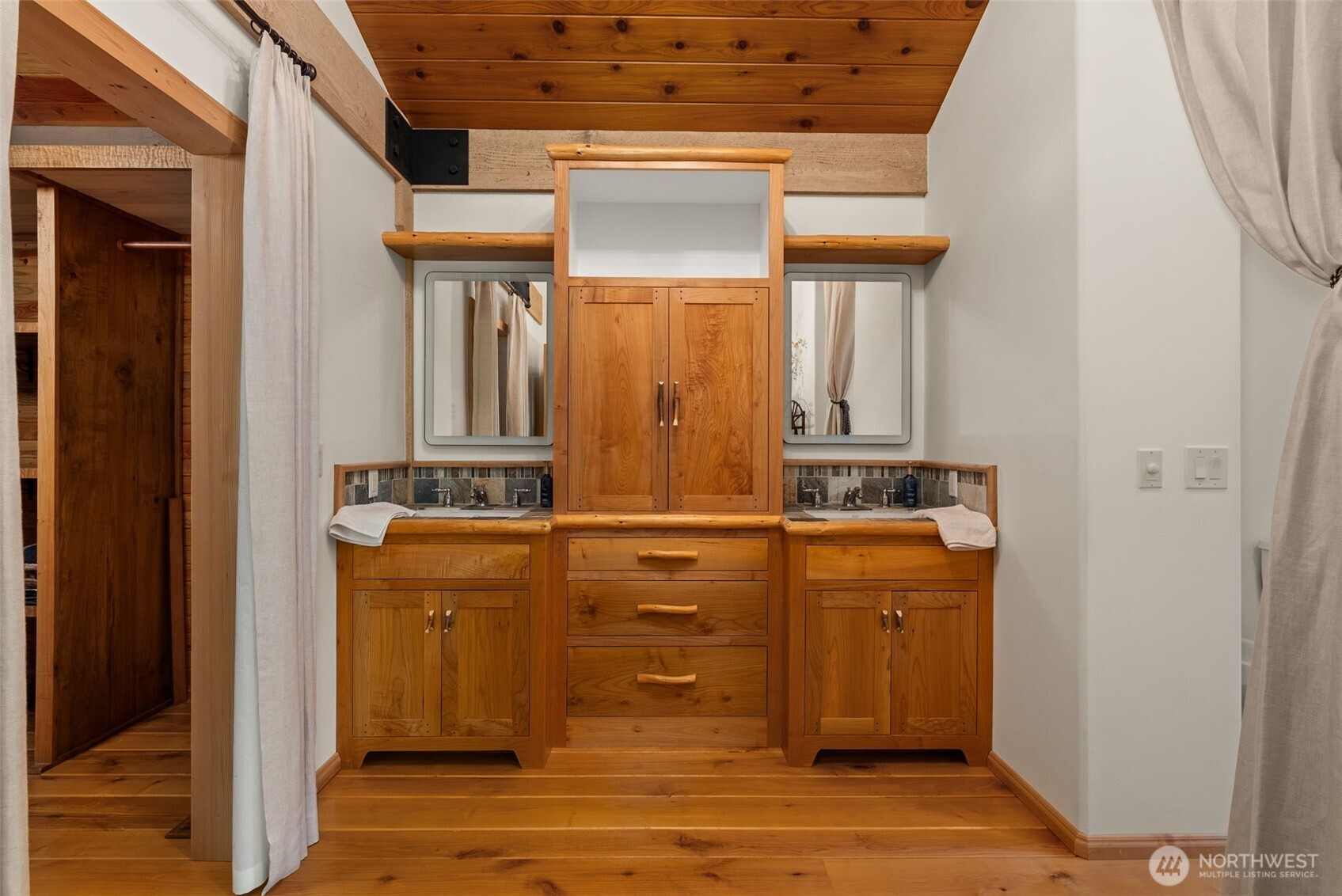 299 Conrad Road Winlock, WA 98596 - Photo 14 of 40 a bathroom with a sink a mirror and cabinets