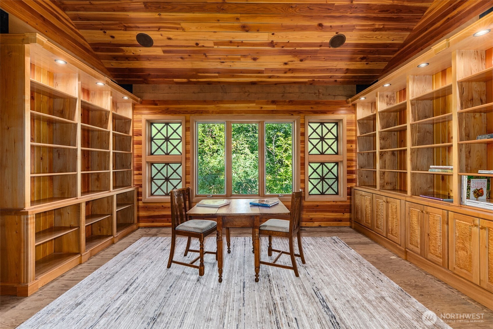 299 Conrad Road Winlock, WA 98596 - Photo 17 of 40 a view of a roof deck with wooden floor and furniture
