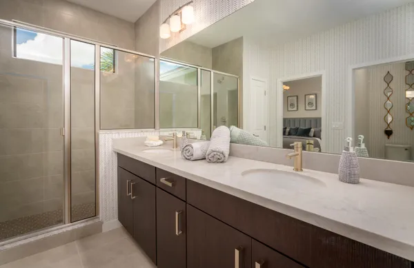 a bathroom with a double vanity sink mirror and double