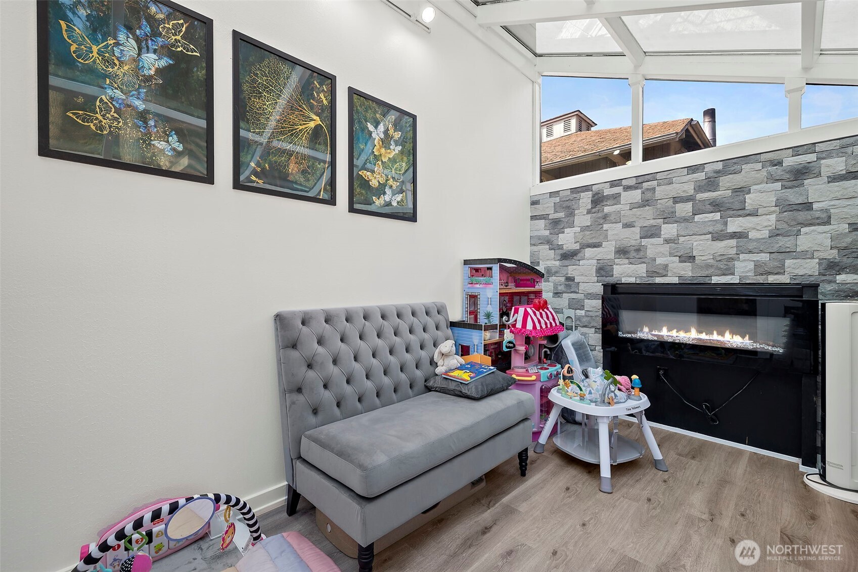 128 Northeast 125th Street Seattle, WA 98125 - Photo 14 of 39 a living room with furniture and a fireplace