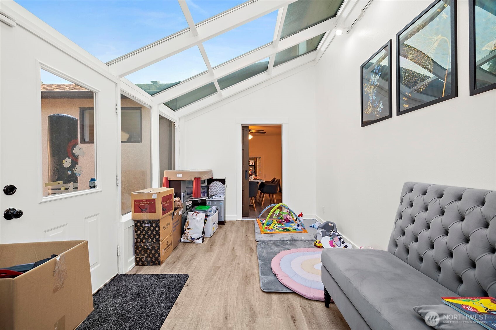 128 Northeast 125th Street Seattle, WA 98125 - Photo 15 of 39 a living room with furniture and wooden floor