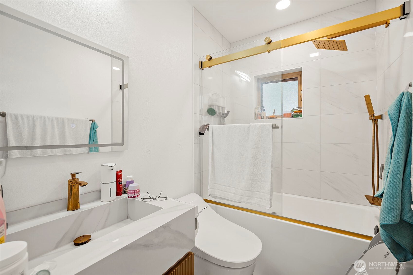 128 Northeast 125th Street Seattle, WA 98125 - Photo 22 of 39 a bathroom with a sink a toilet and shower
