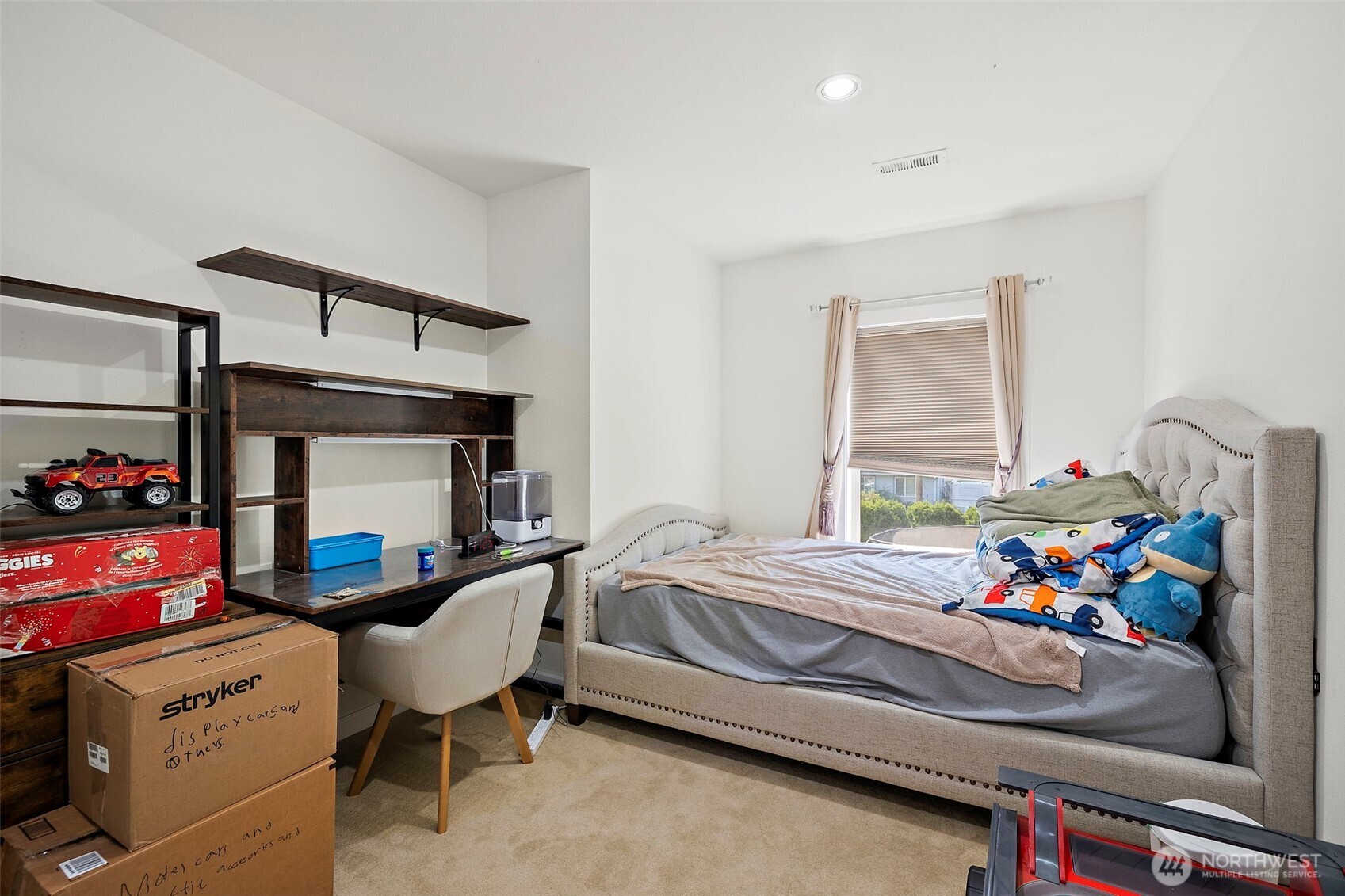 128 Northeast 125th Street Seattle, WA 98125 - Photo 24 of 39 a bedroom with furniture and a bed