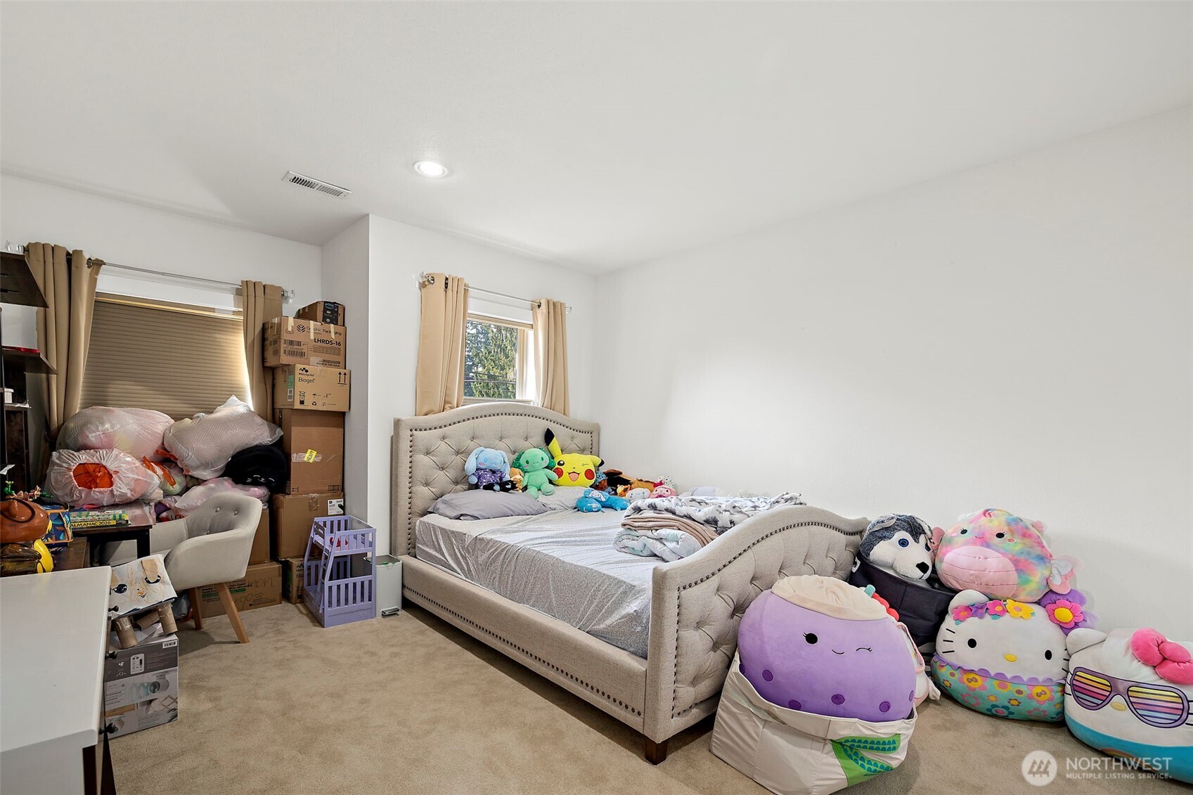 128 Northeast 125th Street Seattle, WA 98125 - Photo 25 of 39 a bedroom with bed and a window