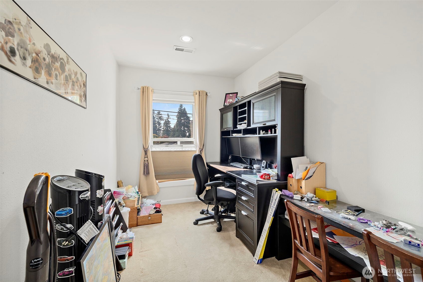 128 Northeast 125th Street Seattle, WA 98125 - Photo 26 of 39 a view of a workspace with furniture and a window