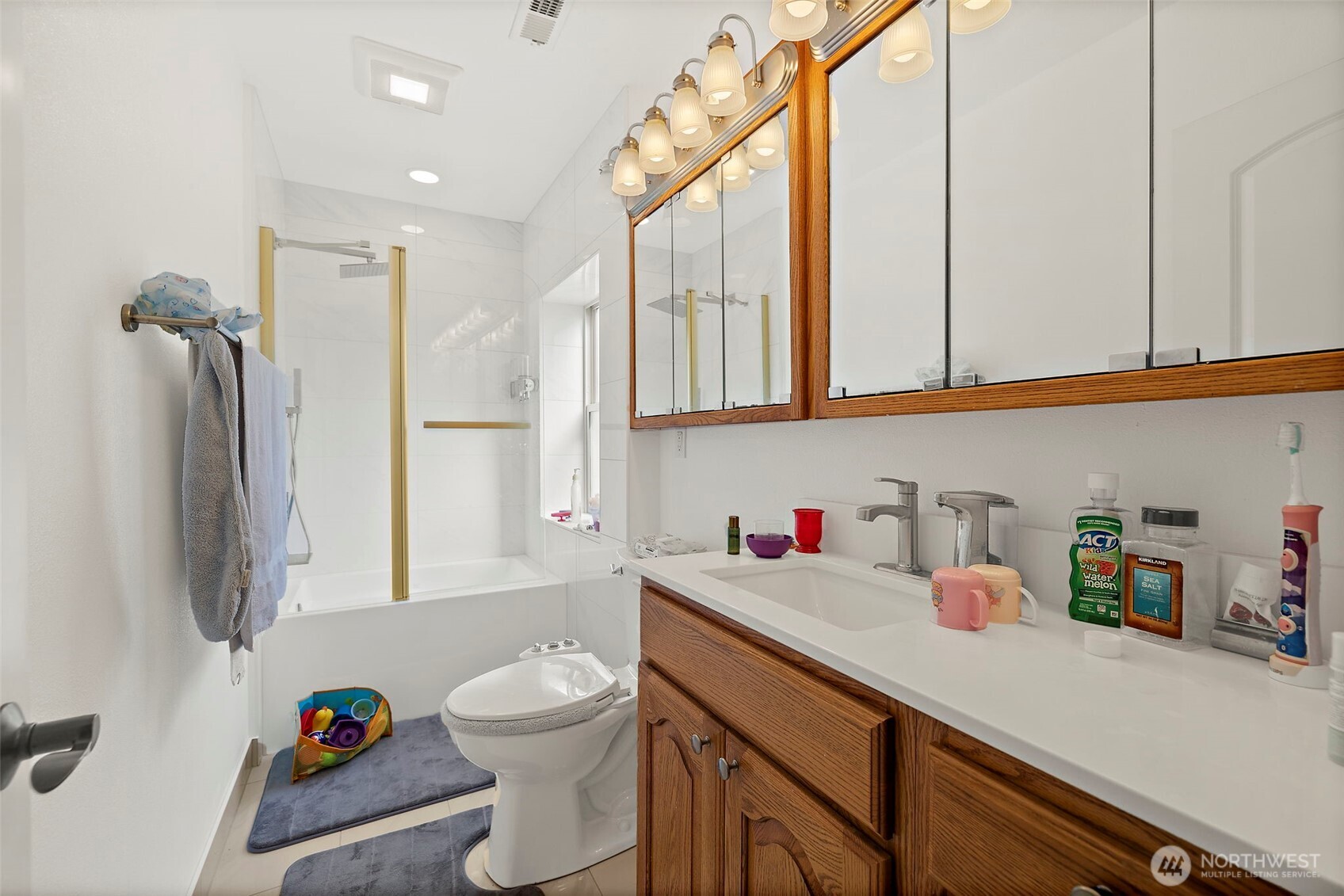 128 Northeast 125th Street Seattle, WA 98125 - Photo 27 of 39 a bathroom with a sink a toilet and a shower