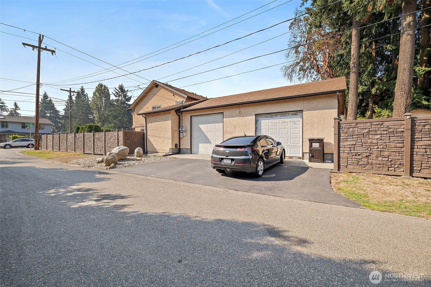 128 Northeast 125th Street Seattle, WA 98125 - Photo 33 of 39 a car parked in front of a house