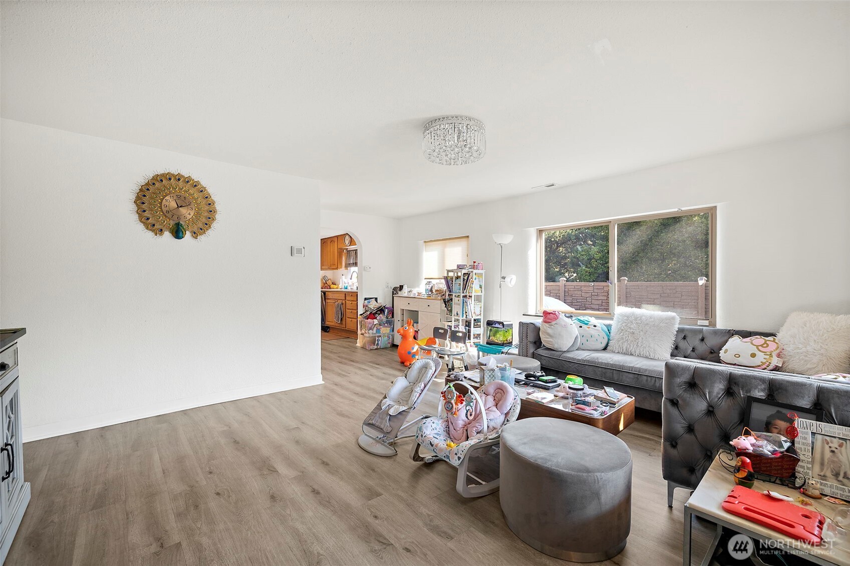 128 Northeast 125th Street Seattle, WA 98125 - Photo 4 of 39 a view of a livingroom with furniture and a window