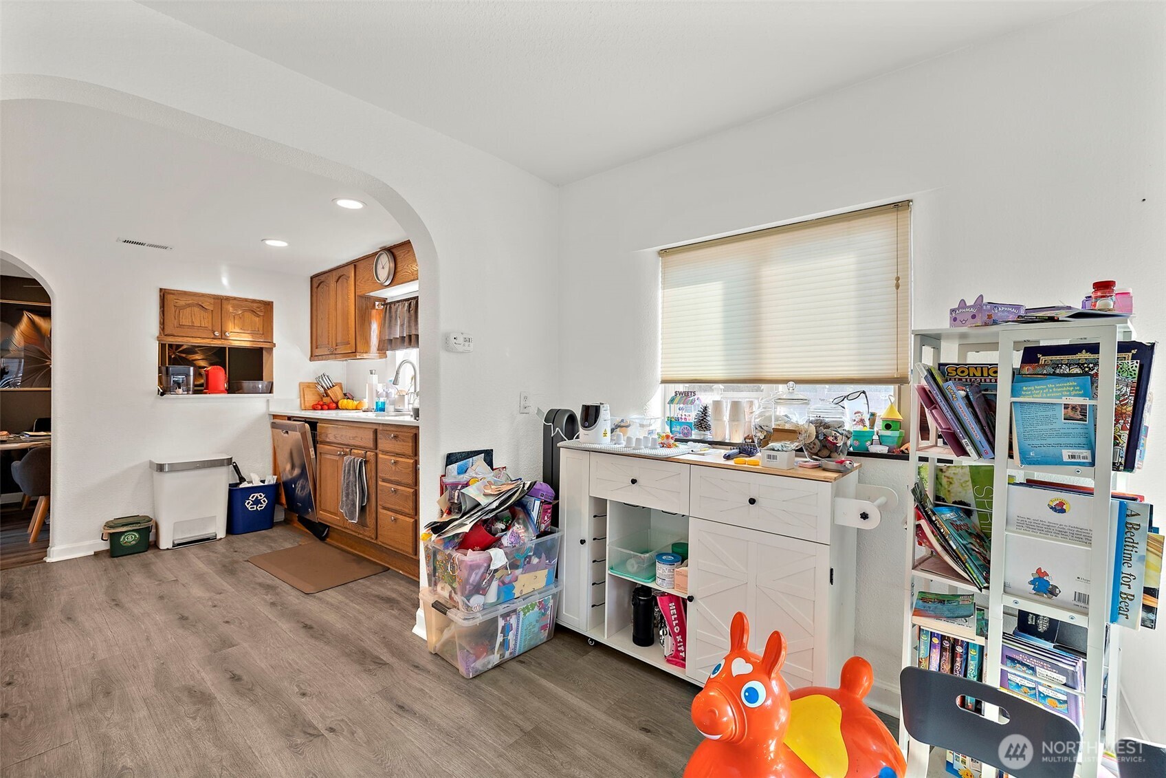 128 Northeast 125th Street Seattle, WA 98125 - Photo 5 of 39 a room with furniture a storage and utility room