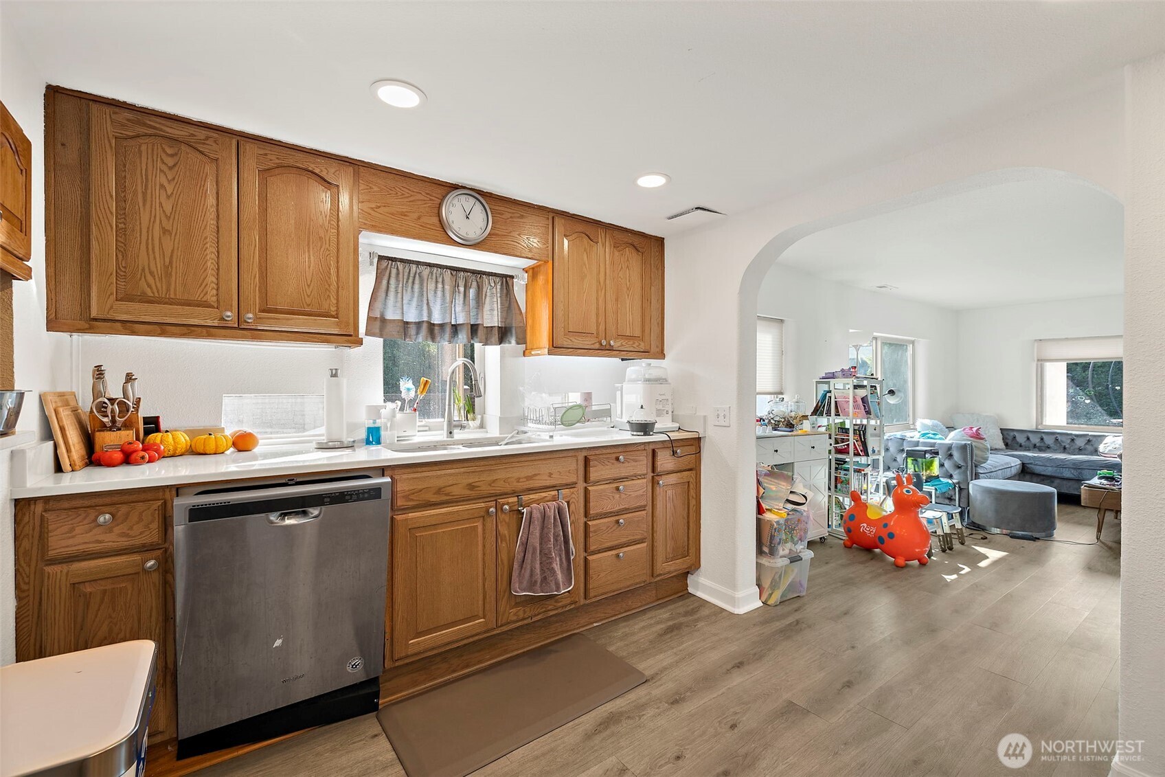 128 Northeast 125th Street Seattle, WA 98125 - Photo 6 of 39 a kitchen that has a sink and cabinets