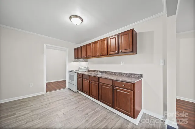 a kitchen with stainless steel appliances granite countertop a stove and a sink