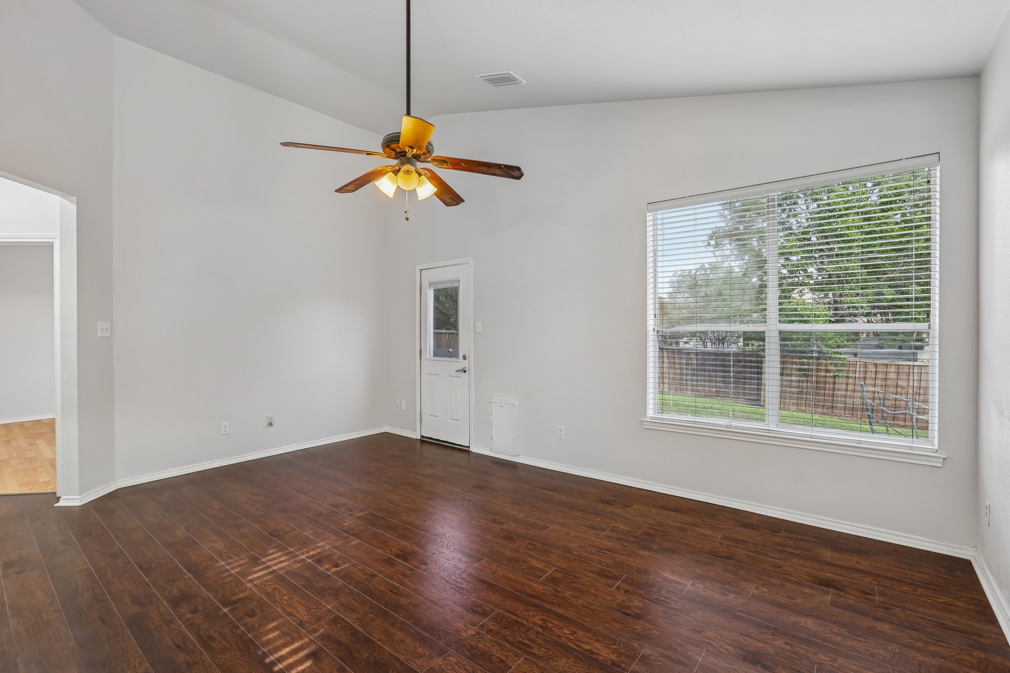 1721 Long Rifle Drive Austin, TX 78754 - Photo 17 of 38 A well-lit living space with rich hardwood flooring awaits your personal touch.