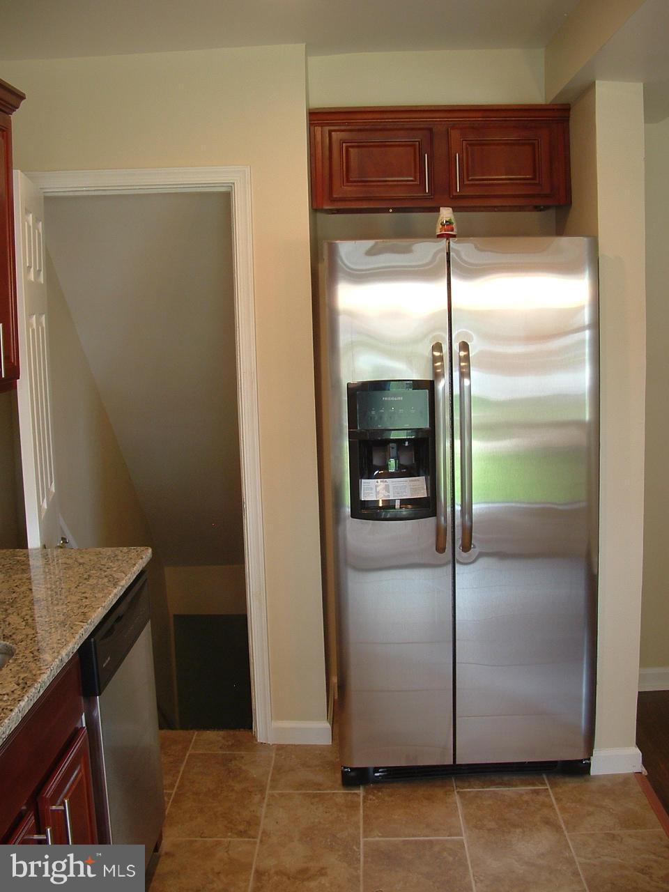 338 Torner Road Baltimore, MD 21221 - Photo 11 of 30 a kitchen with a refrigerator and a counter top