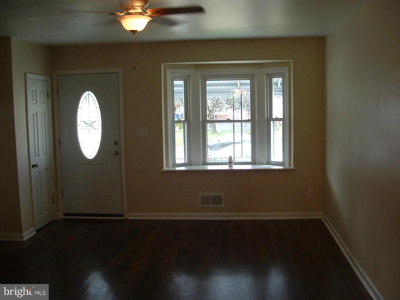 338 Torner Road Baltimore, MD 21221 - Photo 15 of 30 a view of a livingroom with wooden floor and a window