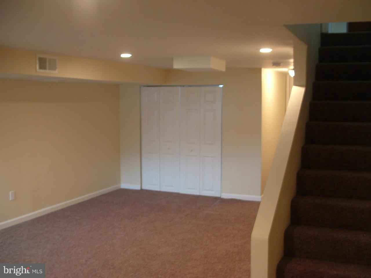338 Torner Road Baltimore, MD 21221 - Photo 18 of 30 an empty room with wooden floor