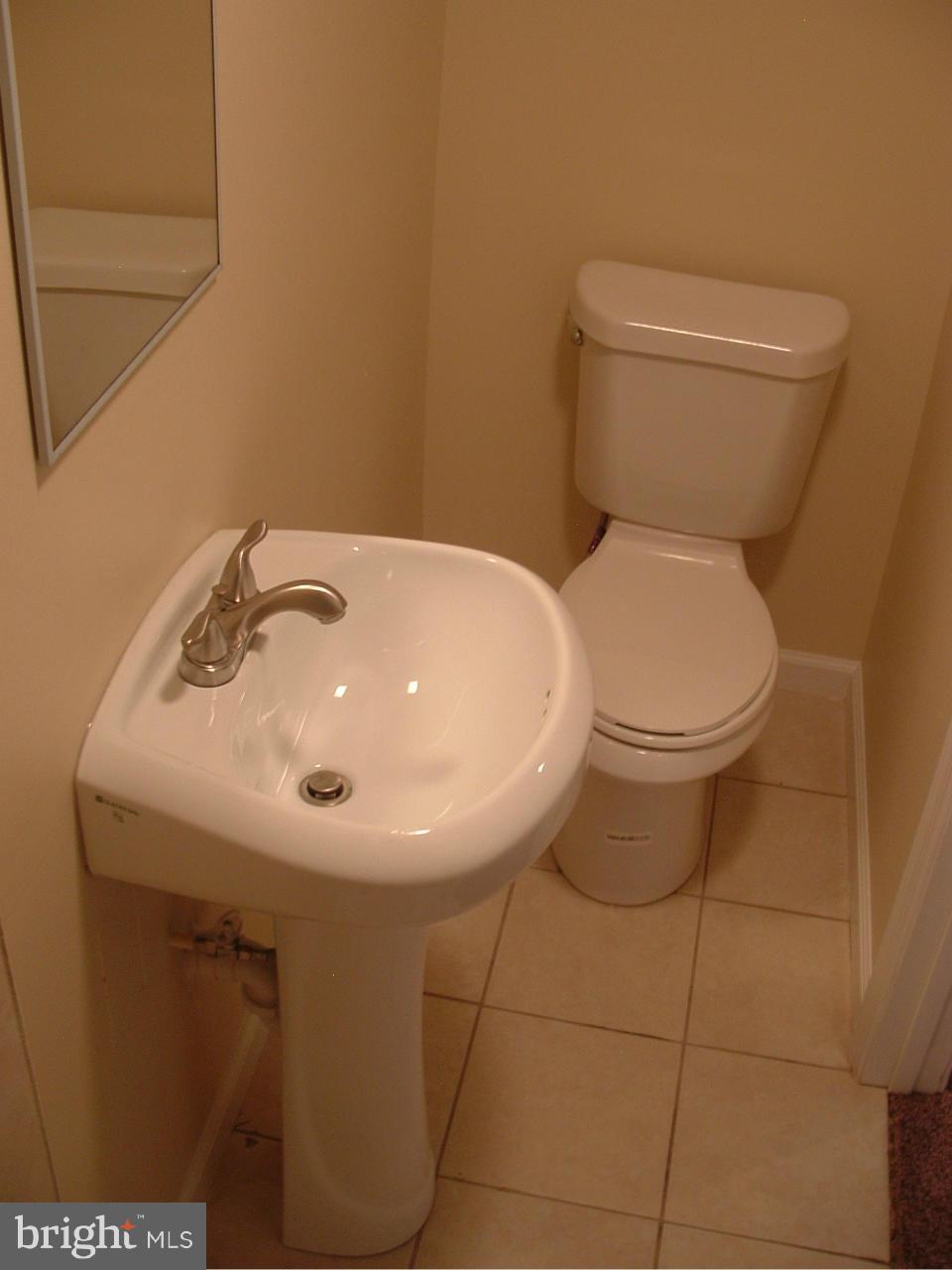 338 Torner Road Baltimore, MD 21221 - Photo 23 of 30 a bathroom with a sink and a toilet