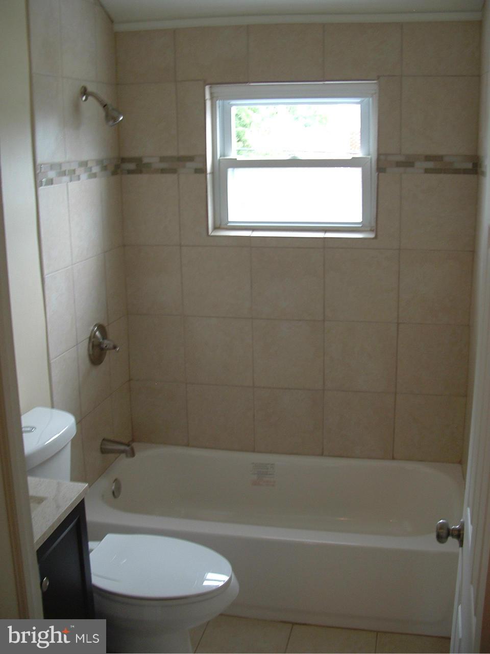 338 Torner Road Baltimore, MD 21221 - Photo 24 of 30 a bathroom with a toilet a sink and shower