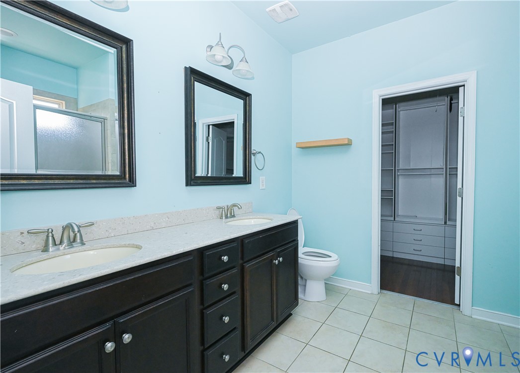 14536 Needham Market Road Midlothian, VA 23112 - Photo 15 of 25 Double vanity with dark wood-finish cabinetry, lig