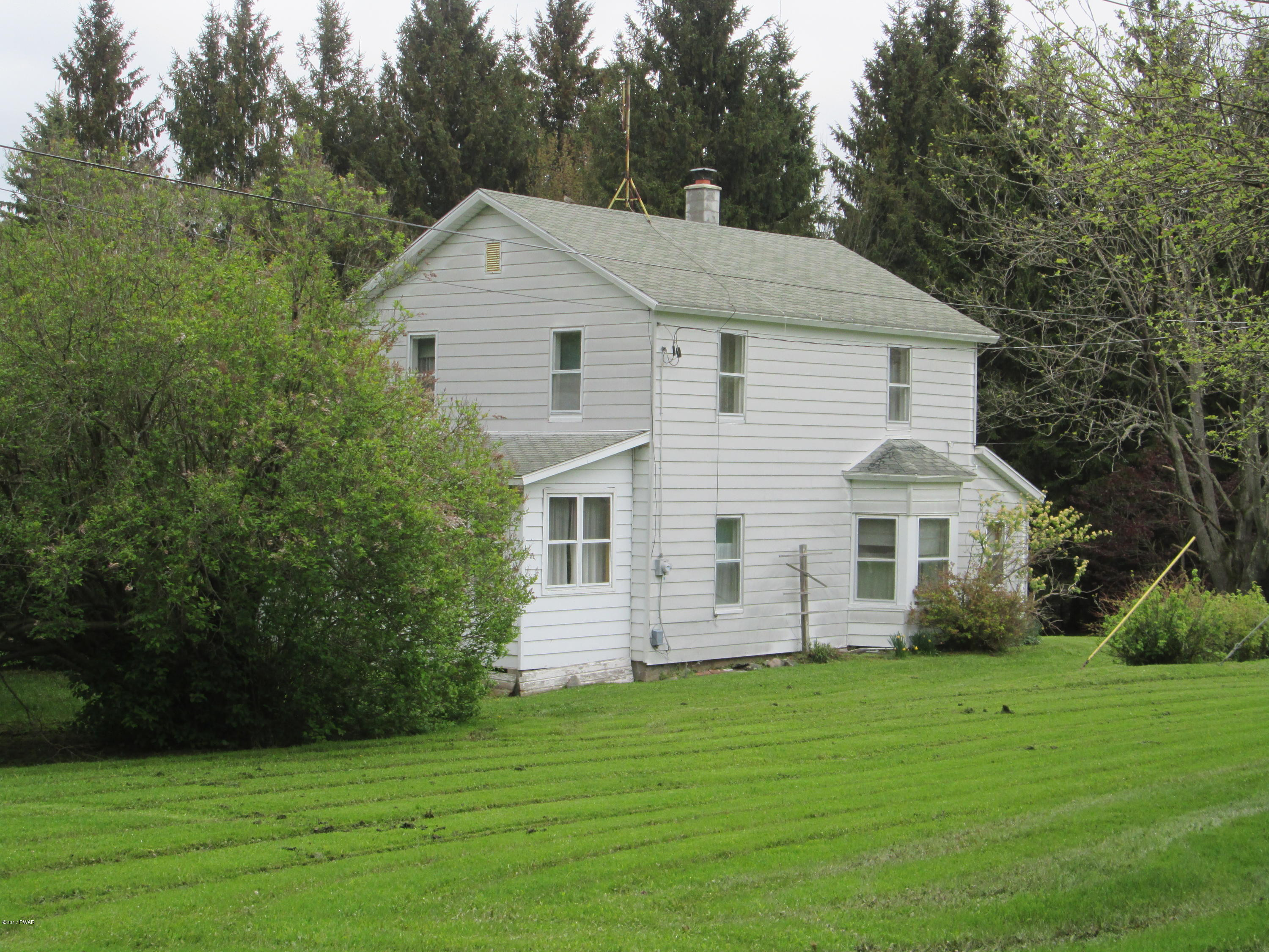 86 Beaver Hollow Road Lakewood, PA 18439 - Photo 1 of 30 a view of a house with a yard