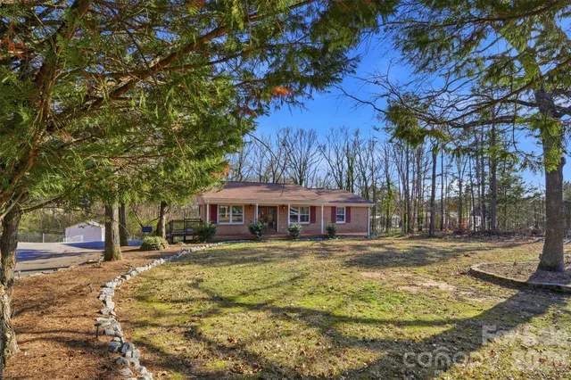 a house with swimming pool in front of it