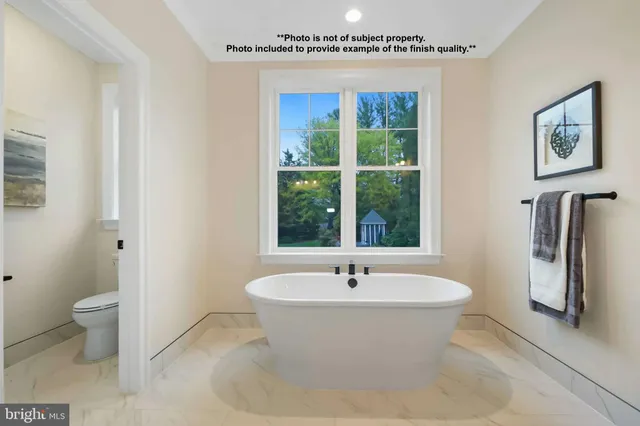 a bathroom with a bathtub and a sink
