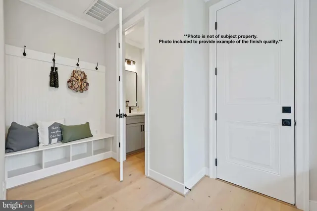 a bedroom with a bed and glass door