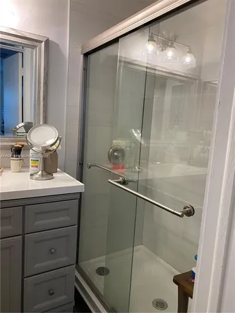 a bathroom with a sink and mirror