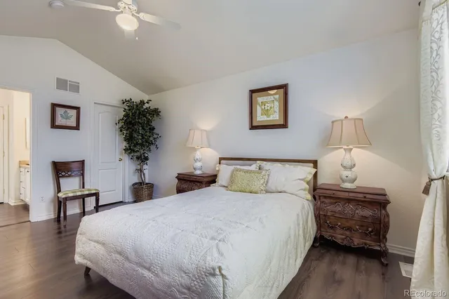 a bedroom with a bed and a table