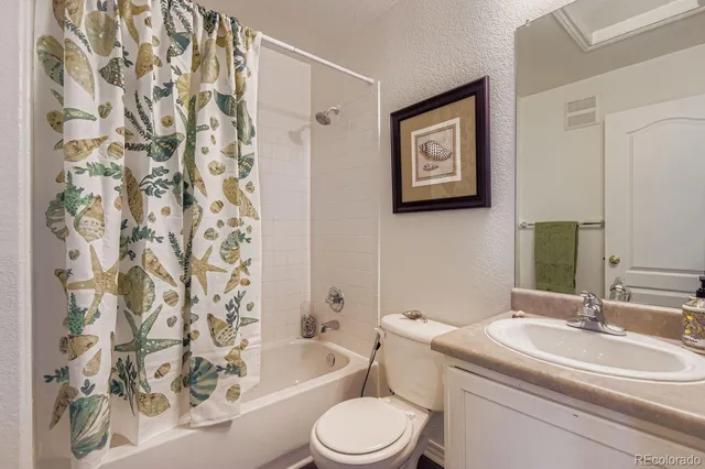 a bathroom with a toilet a sink and a bathtub