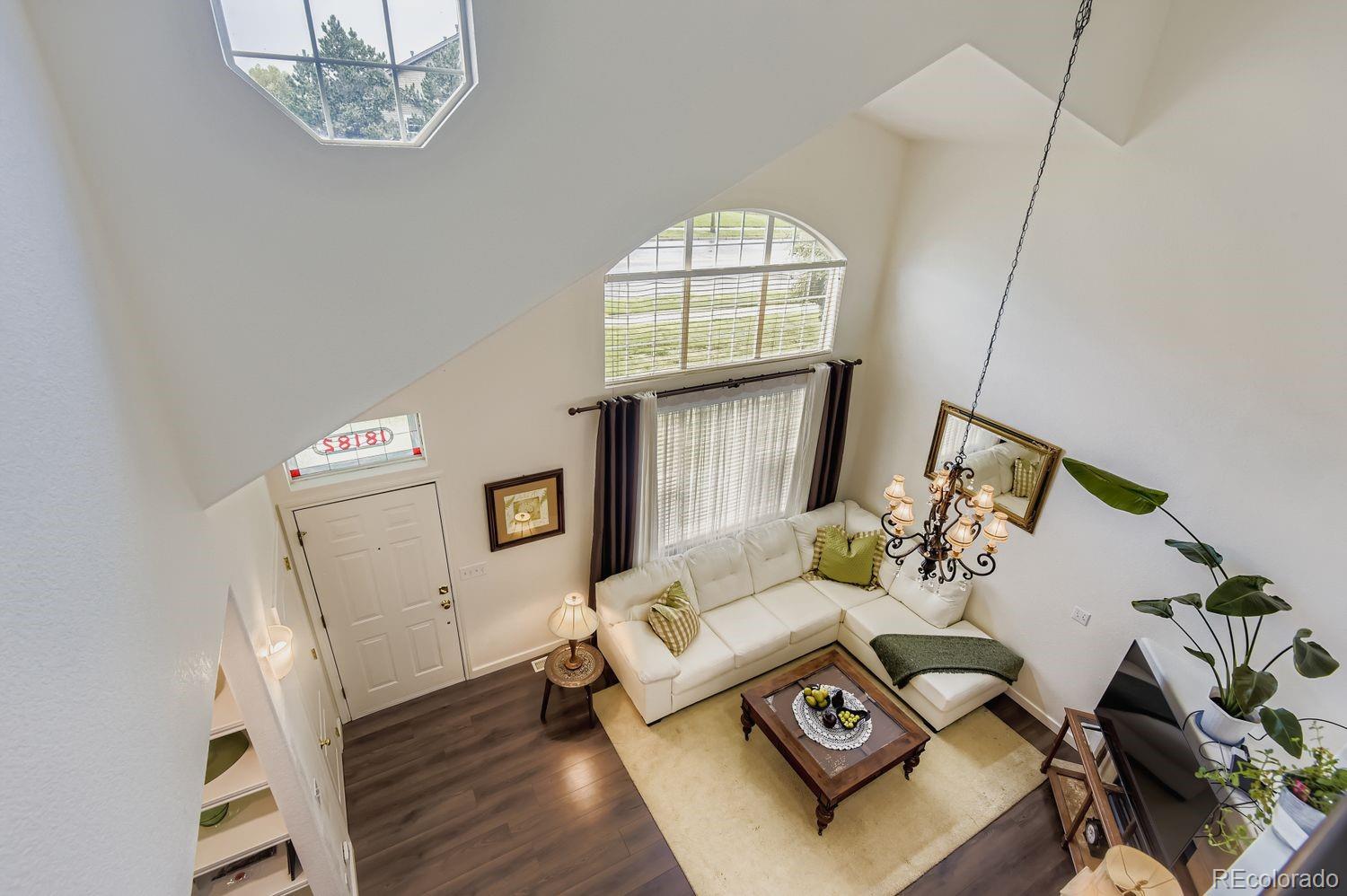 Undisclosed Address Aurora, CO 80013 - Photo 18 of 20 a living room with furniture and a window