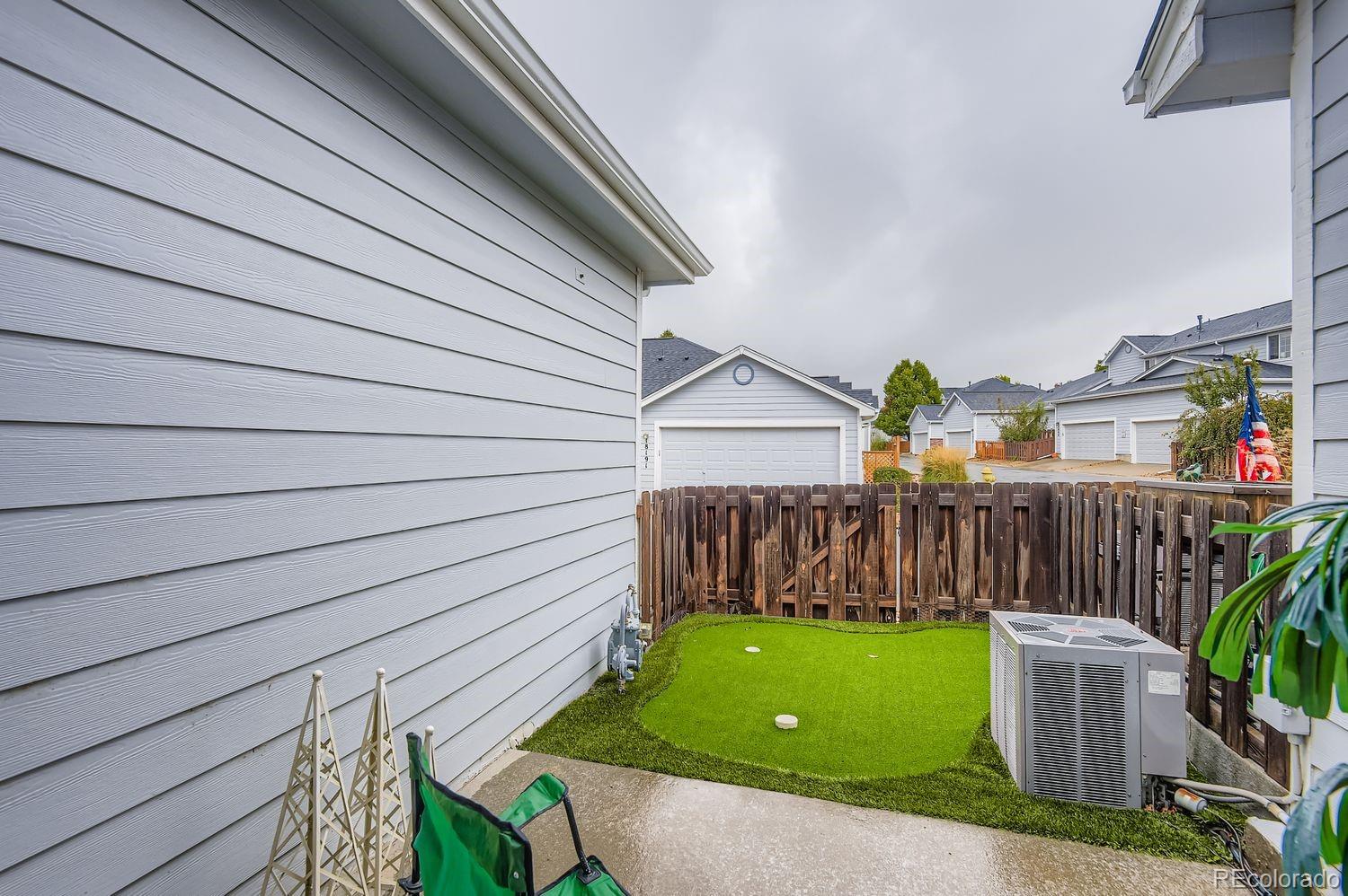 Undisclosed Address Aurora, CO 80013 - Photo 19 of 20 a view of a backyard with a garden