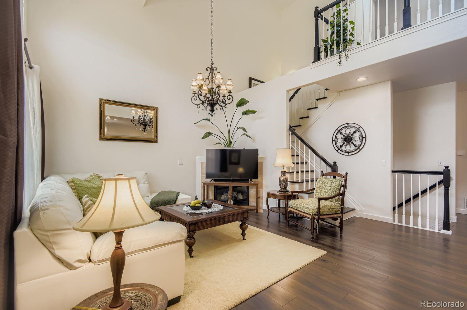 Undisclosed Address Aurora, CO 80013 - Photo 2 of 20 a living room with furniture and wooden floor