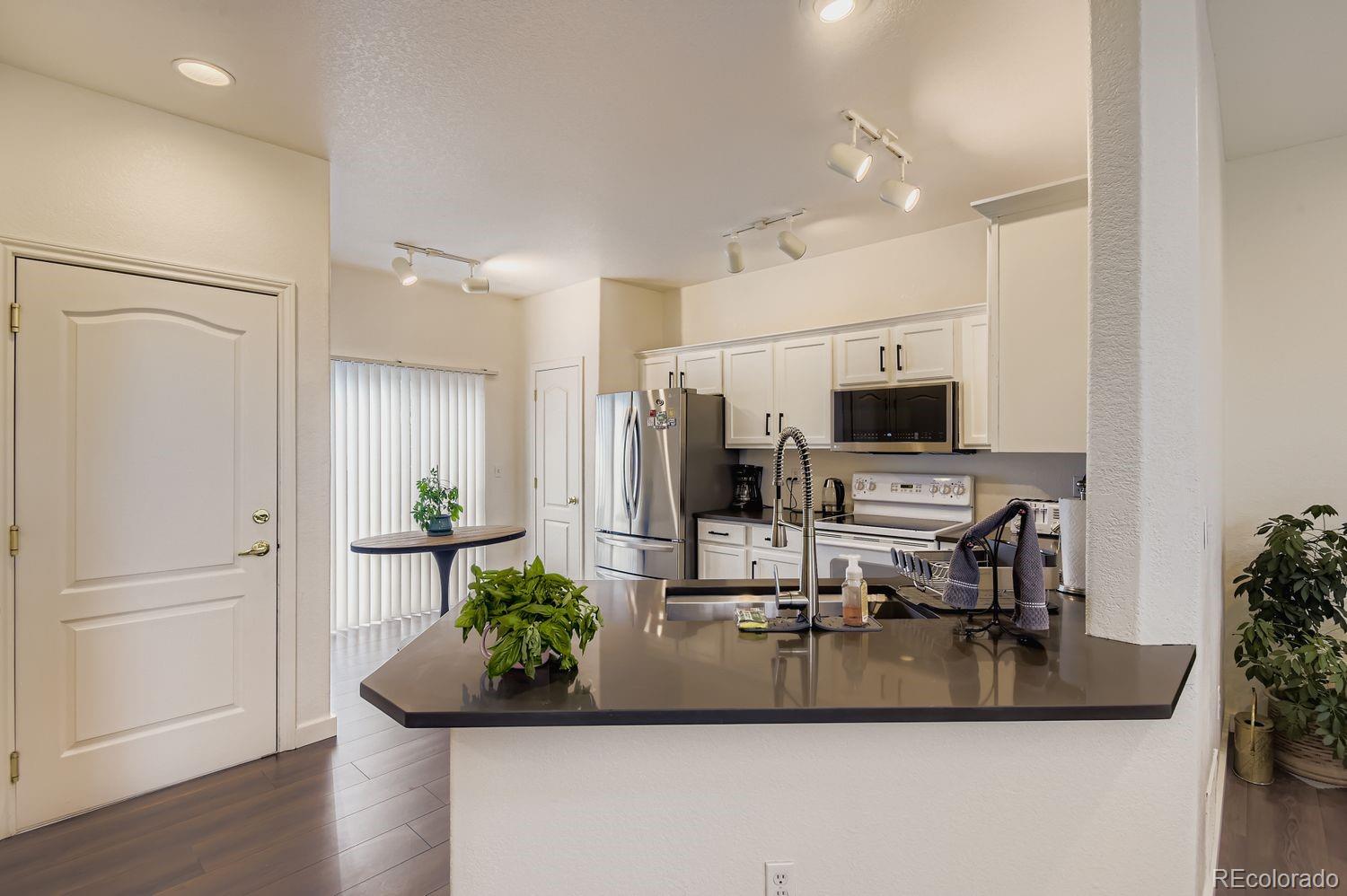Undisclosed Address Aurora, CO 80013 - Photo 5 of 20 a view of living room with furniture and flat screen tv
